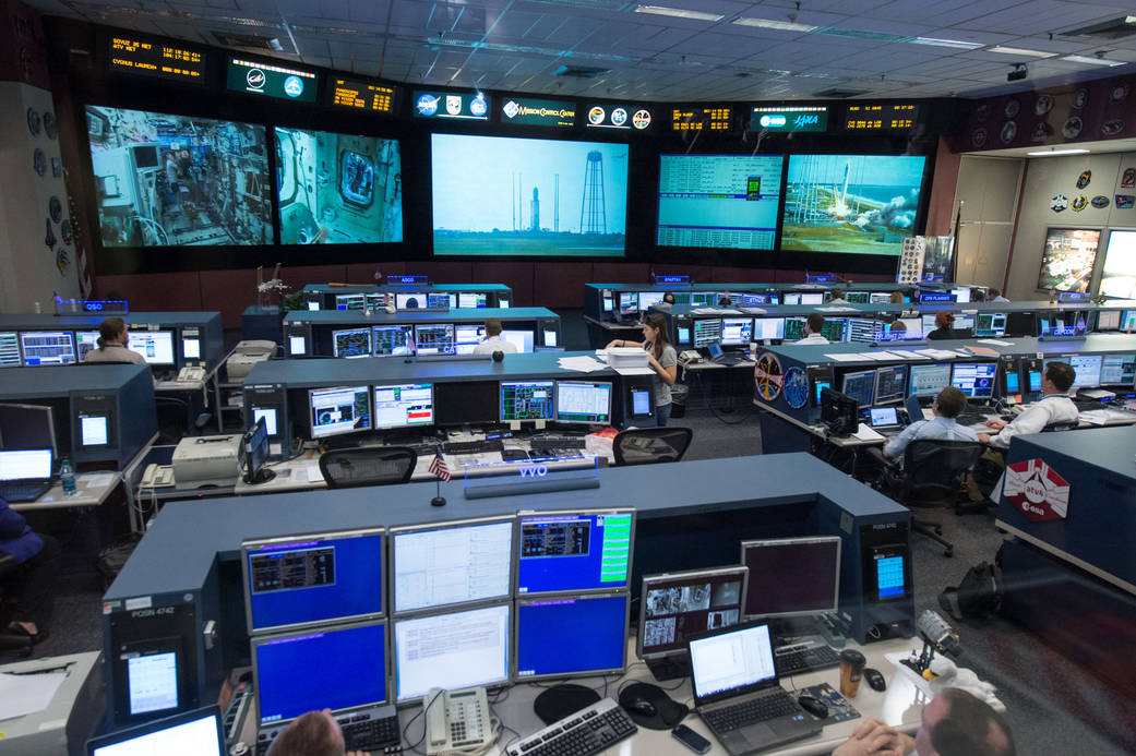 NASA Johnson Space Center Space Mission Operations Control Room monitors and desks